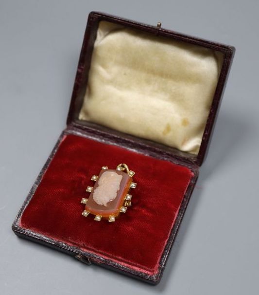 A yellow metal and sardonyx cameo hardstone and seed pearl set pendant brooch,